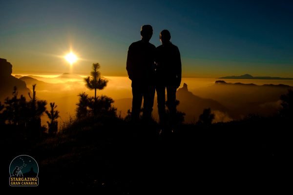 Couple watching the sunset above the clouds on our Gran Canaria sunset and stargazing tour.